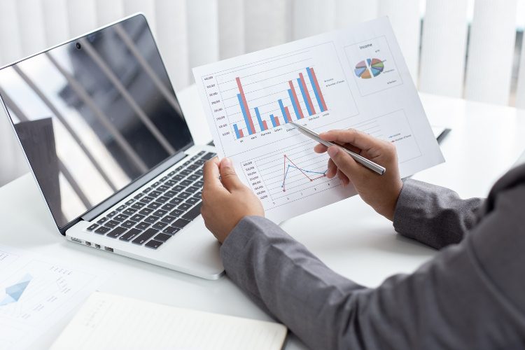 man working on graphs