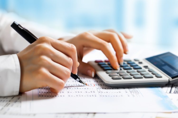 woman using calculator