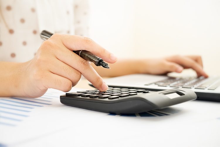 woman using calculator